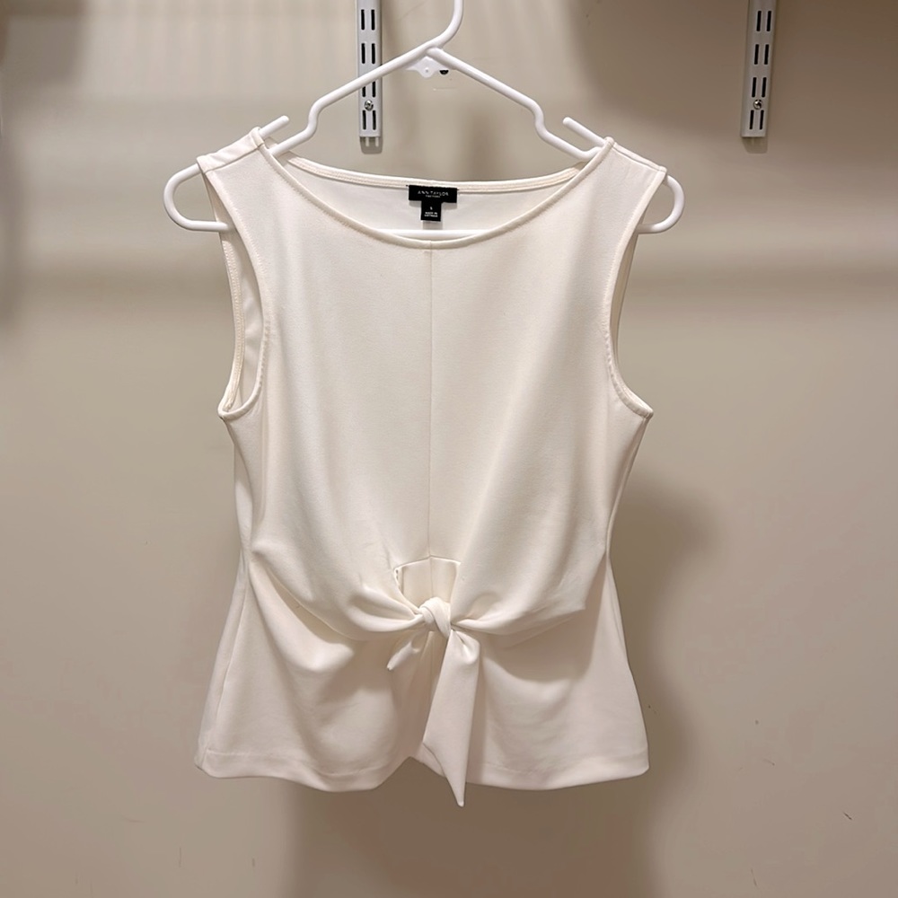 Sleeveless knotted ivory peplum blouse